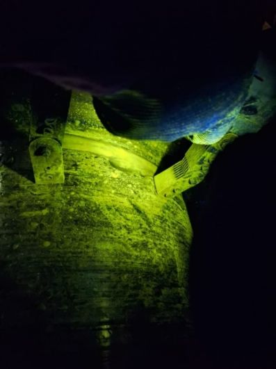 Fluorescent magnetic particle indications under ultraviolet light